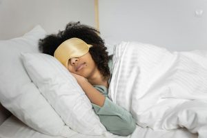 a woman sleeping on the bed
